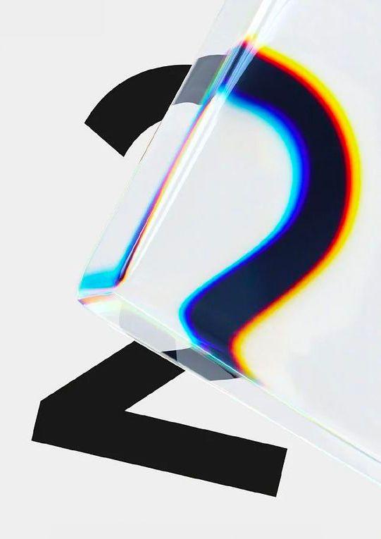 A black numeral seen through a glass block, its edges split into bands of red, blue and yellow.